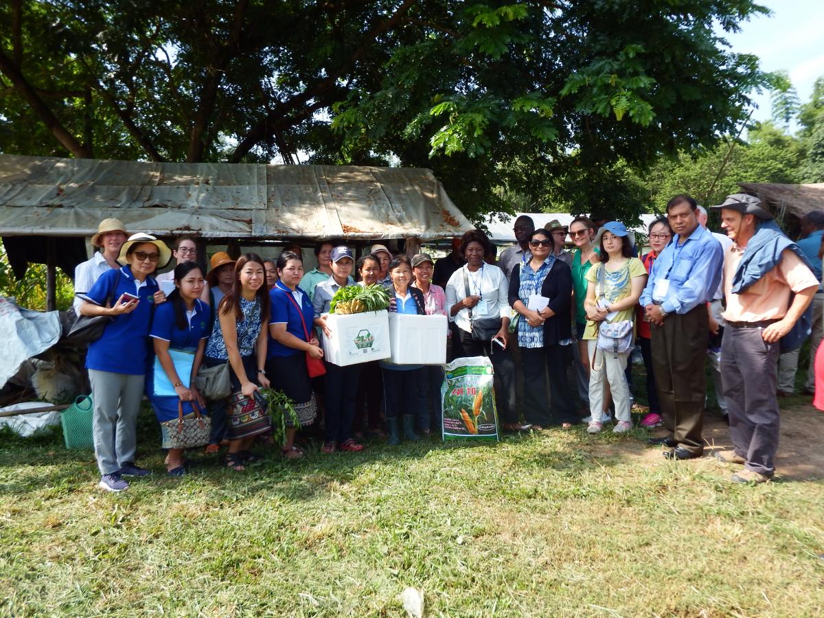 Members of the Thongmang organic growers group being presented with seeds and soil improvers at the end of a visit by members of the CDAIS team and representatives of the TAP and EU